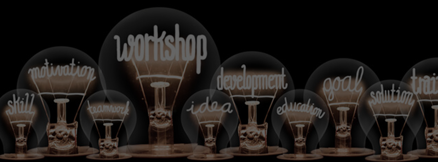 A collection of light bulbs with the word "workshop" creatively displayed among them