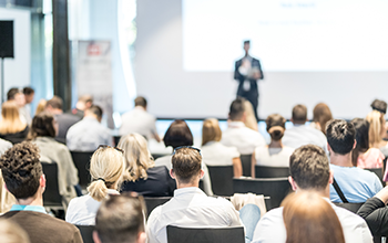 Male Business Speaker Giving A Talk At Business Conference Event.
