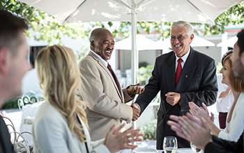 Businesspeople celebrating achievements in restaurant 