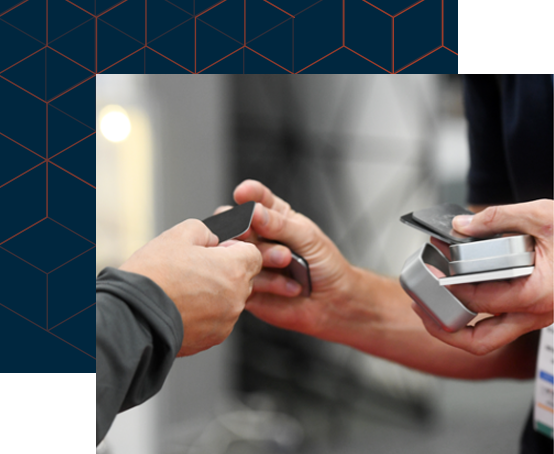 Two hands exchanging business cards
